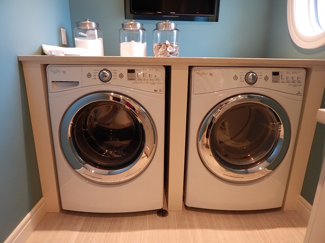 A washing machine and dryer in laundry room.
